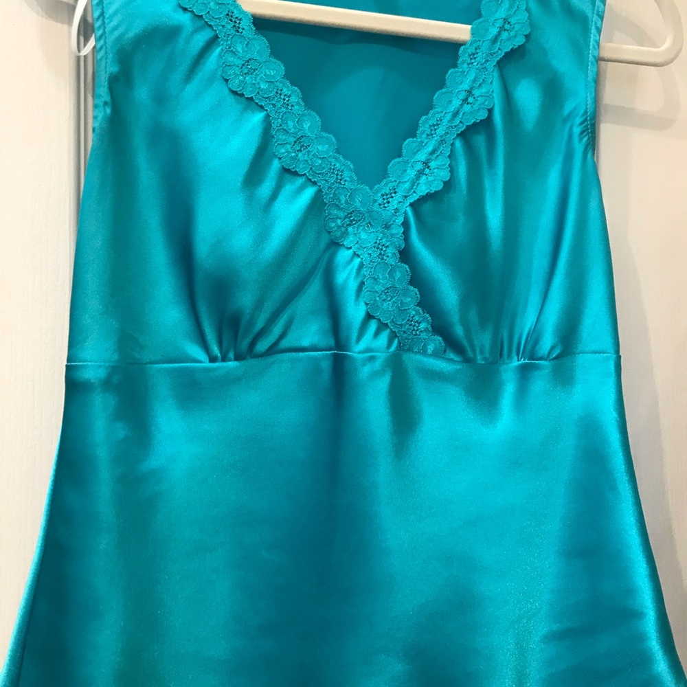 Turquoise sleeveless blouse